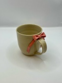 Uroczy kubek ceramiczny z koralową kokardką ok 300ml